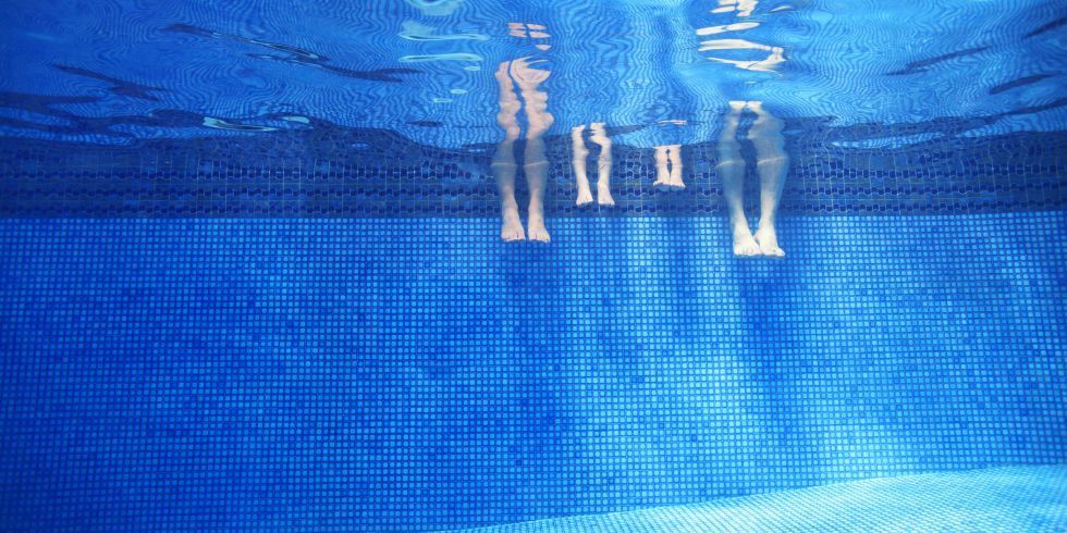 Family's Legs in Pool