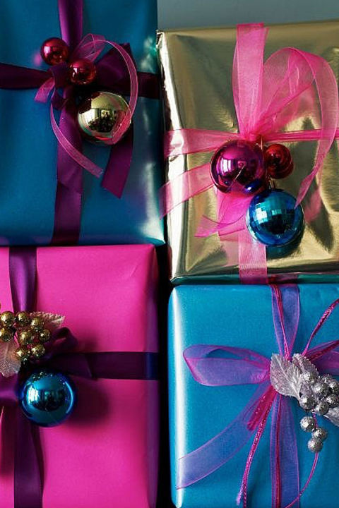 Ornaments aren't just for the tree. Tie some gorgeous ribbons through your favorite holiday balls and wrap them around a brightly colored box. Voila! You already you have a beautiful gift to present under your tree.
Get the tutorial at Older and Wisor.